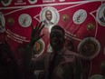 Main opposition Movement for Democratic Change (MDC) supporters celebrate prematurely outside their headquarters in Harare, Zimbabwe, Tuesday, July 31, 2018, believing they have won the elections that took place Monday. (AP Photo/Mujahied Safodien)