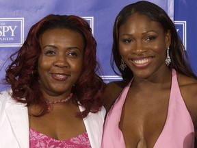 Serena Williams poses her oldest sister Yetunde Price and her "Best Female Athlete" award backstage during the 2003 ESPY Awards at the Kodak Theatre July 16, 2003 in Hollywood, Calif.