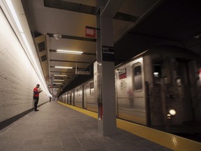 A downtown 1 train pulls into the newly-opened WTC Cortlandt subway station in New York on Saturday evening, Sept. 8, 2018. The old Cortlandt Street station on the subway system's No. 1 line was buried under the rubble of the World Trade Center's twin towers on Sept. 11, 2001. Construction of the new station was delayed until the rebuilding of the surrounding towers was well under way. (AP Photo/Patrick Sison)