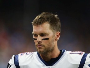 Quarterback Tom Brady #12 of the New England Patriots on the sidelines during the first half at Ford Field on September 23, 2018 in Detroit, Michigan.