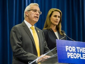 Ontario's Minister of Finance Vic Fedeli and Attorney General Caroline Mulroney deliver remarks following an announcement on Ontario's cannabis retail model on Aug. 13, 2018. THE CANADIAN PRESS/Christopher Katsarov ORG XMIT: CKL103 Caroline Mulroney, Vic Fideli