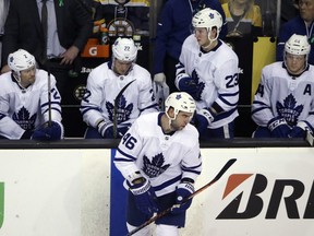 Leafs' defencemen (from left) Ron Hainsey, Nikita Zaitsev, Roman Polak (no longer with team), Travis Dermott and Morgan Rielly sit on the bench during the playoffs last season. (AP PHOTO)