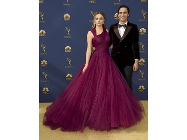 Joey King, left, and Zac Posen arrive at the 70th Primetime Emmy Awards on Monday, Sept. 17, 2018, at the Microsoft Theater in Los Angeles.
