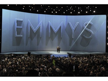 Kate McKinnon, left, and Kenan Thompson speak at the 70th Primetime Emmy Awards on Monday, Sept. 17, 2018, at the Microsoft Theater in Los Angeles.