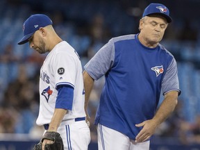 Toronto Blue Jays manager John Gibbons takes starting pitcher Marco Estrada out of the game last week against the Houston Astros. THE CANADIAN PRESS)