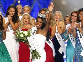 Miss New York Nia Franklin reacts after being named Miss America 2019, Sunday, Sept. 9, 2018, in Atlantic City, N.J. (AP Photo/Noah K. Murray)