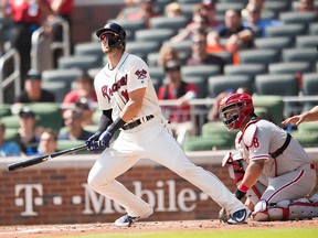 Lane Adams of the Atlanta Braves the hits a home run against the Philadelphia Phillies in the 5th inning at SunTrust Park on Sept. 23, 2018 in Atlanta, Ga.