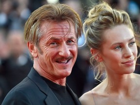 In this file photo taken on May 20, 2016 US actor and director Sean Penn (L) smiles as he arrives with his daughter US actress Dylan Penn for the screening of the film "The Last Face" at the 69th Cannes Film Festival in Cannes, southern France.