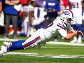 Buffalo Bills quarterback Josh Allen dives for extra yardage during the first half of an NFL game against the Minnesota Vikings, Sunday, Sept. 23, 2018, in Minneapolis.
