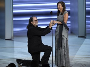 Glenn Weiss , left, proposes to Jan Svendsen at the 70th Primetime Emmy Awards on Monday, Sept. 17, 2018, at the Microsoft Theater in Los Angeles.