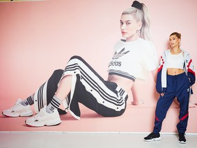 Hailey Baldwin poses ahead of the launch of the Icy Pink adidas Falcon at JD show on Sept. 17, 2018 in London, England.