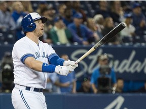 Toronto Blue Jays designated hitter Justin Smoak (14) watches as he hits the game winning walk off home run to defeat the Tampa Bay Rays during ninth inning AL baseball action in Toronto on Thursday, September 20, 2018.