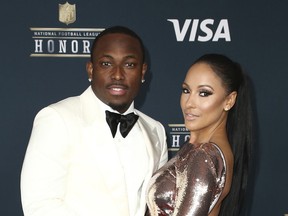 FILE - In this Feb. 4, 2017, file photo, LeSean McCoy of the Buffalo Bills, left, and Delicia Cordon arrive at the 6th annual NFL Honors at the Wortham Center in Houston. Lawyers for LeSean McCoy have asked a judge in Georgia to throw out a lawsuit filed by the Buffalo Bills running back's former girlfriend that accuses him of failing to protect her from a violent home invasion. The lawsuit filed last month by Delicia Cordon alleges that McCoy failed to protect her after she was bloodied, beaten and had $133,000 worth of jewelry stolen by an intruder at a home McCoy owns in Milton, just outside Atlanta.