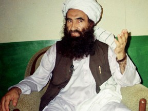 In this Aug. 22, 1998, file photo, Jalaluddin Haqqani, founder of the militant group the Haqqani network, speaks during an interview in Miram Shah, Pakistan.
