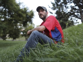 This photo taken Aug. 15, 2018, shows Johnny Bobbitt Jr., the homeless veteran who gave $20 for gas for Kate McClure, back on the streets with his brother. (David Swanson /The Philadelphia Inquirer via AP)