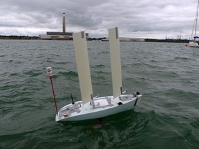 In this photo taken on Monday, Aug. 27, 2018, A robotic boat operated by a team from China's Shanghai Jiaotong University undergoes testing at the World Robot Sailing Championship in Southampton, England.
