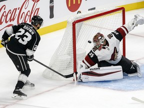 Los Angeles Kings forward Dustin Brown (23) scores on Arizona Coyotes goalie Darcy Kuemper (35) Tuesday, Sept. 18, 2018, in Los Angeles. (AP Photo/Ringo H.W. Chiu)