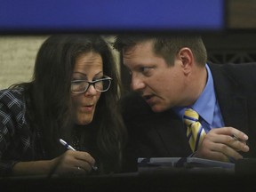Chicago police Officer Jason Van Dyke talks to defence attorney Tammy Wendt during his trial for the shooting death of Laquan McDonald, at the Leighton Criminal Court Building Wednesday, Sept. 19, 2018, in Chicago.