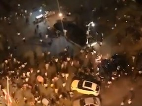 People run after an SUV rammed into a crowd in Hengyang, China. (Twitter/ZhangZhulin)