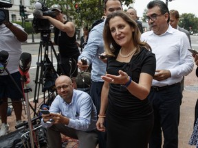 Foreign Affairs Minister Chrystia Freeland talks with reporters as she arrives at the Office Of The United States Trade Representative, in Washington, Tuesday, Sept. 11, 2018.