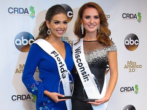 Miss Florida, Taylor Tyson, left, and Miss Wisconsin, Tianna Vanderhei, pose for photos after the first night of preliminary competition at the Miss America competition in Atlantic City, N.J., Wednesday, Sept. 5, 2018.