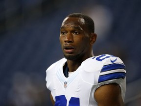 This is an Oct. 27, 2013, file photo showing Dallas Cowboys running back Joseph Randle watching during warmups before an NFL football game against the Detroit Lions in Detroit. Police in suburban Dallas say Randle has been arrested after taking underwear and cologne from a mall department store without paying. Frisco Police Sgt. Brad Merritt says Randle is charged with Class B misdemeanor theft. He was detained Monday evening, Oct. 13, 2014, by store security before being arrested and booked into the Frisco city jail. Merritt says Randle posted bond early Tuesday.