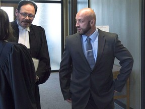 A young woman has told the trial of a U.K. sailor that she woke up face down on a bed in the barracks of a Halifax-area military base naked with at least three men performing sex acts on her. Darren Smalley, right, a British sailor charged with sexual assault causing bodily harm, walks outside the court room in Nova Scotia Supreme Court in Halifax on Wednesday, Sept. 5, 2018.