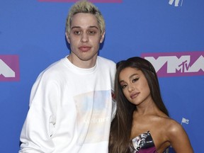 Pete Davidson, left, and Ariana Grande arrive at the MTV Video Music Awards at Radio City Music Hall in New York on Aug. 20, 2018.