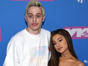 Pete Davidson, left, and Ariana Grande arrive at the MTV Video Music Awards at Radio City Music Hall on Monday, Aug. 20, 2018, in New York.