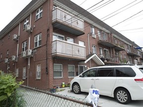 The house were five people were stabbed overnight is seen, Friday, Sept. 21, 2018, in New York. Police say the people, including three infants, were stabbed at an overnight day care center in New York City.