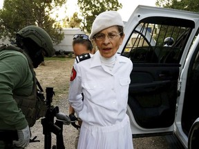 In this Aug. 20, 2017 file photo provided by the Cibola County Sheriff's Office, Deborah Green, leader of a New Mexico paramilitary religious sect, is arrested outside of the group's secluded Fence Lake, N.M. compound.