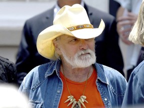 In this June 3, 2017, file photo, founding member of the Allman Brothers Band Dickey Betts exits the funeral of Gregg Allman at Snow's Memorial Chapel, in Macon, Ga.