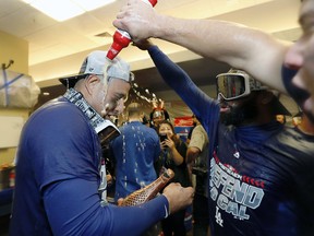 The Los Angeles Dodgers celebrate clinching a playoff spot after beating the San Francisco Giants Saturday, Sept. 29, 2018. (AP Photo/Jim Gensheimer)