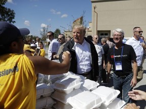 U.S. President Donald Trump visits the Temple Baptist Church, where food and other supplies are being distributed during Hurricane Florence recovery efforts, in New Bern, N.C., Wednesday, Sept. 19, 2018.
