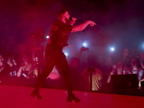 Drake performs during the "Aubrey & The Three Amigos Tour" in Toronto, Aug. 21, 2018.
