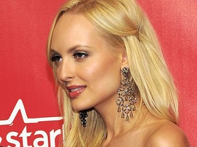 In this Feb. 10, 2012 file photo, Playboy "bunny" Shera Bechard arrives at the MusiCares Person of the Year gala in Los Angeles. Bechard, a former Playboy centerfold model who claims to have had an affair with a top fundraiser for President Donald Trump, wants him to pay an additional $200,000, beyond a $1.6 million settlement. A redacted copy of Bechards lawsuit against Elliott Broidy was released Tuesday, July 31, 2018. (AP Photo/Chris Pizzello, File)