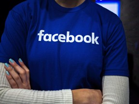 Guests are welcomed by people in Facebook shirts as they arrive at the Facebook Canadian Summit in Toronto on Wednesday, March 28, 2018.