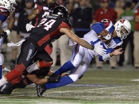 Montreal Alouettes quarterback Antonio Pipkin (17) rushes for the first down as Ottawa Redblacks defensive back Anthony Cioffi (24) defends during first half CFL action in Ottawa on Friday, Aug. 31, 2018.