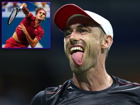 Switzerland's Roger Federer (inset) serves the ball to Australia's John Millman during their 2018 U.S. Open Men's Singles tennis match at the USTA Billie Jean King National Tennis Center in New York on Sept. 3, 2018.  (EDUARDO MUNOZ ALVAREZ/AFP/Getty Images/Alex Pantling/Getty Images)