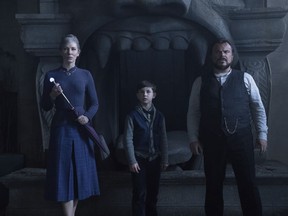 This image released by Universal Pictures shows Cate Blanchette, from left, Owen Vaccaro and Jack Black in a scene from "The House With A Clock in Its Walls."