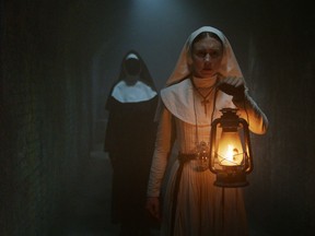 This image released by Warner Bros. Pictures shows Taissa Farmiga in a scene from "The Nun." (Warner Bros. Pictures via AP)