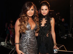Singer/actresses Demi Lovato (L) and Selena Gomez arrive at the 2011 MTV Video Music Awards at Nokia Theatre L.A. LIVE on August 28, 2011 in Los Angeles, California.