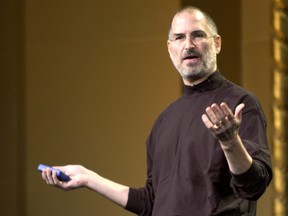 Steve Jobs of Apple Computer celebrates the release of a new Apple iPod family of products at the California Theatre on October 26, 2004 in San Jose Calif. (Tim Mosenfelder/Getty Images)
