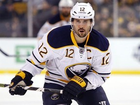 FILE - In this Feb. 6, 2016, file photo, Buffalo Sabres' Brian Gionta is shown during the first period of an NHL hockey game against the Boston Bruins, in Boston. A person with direct knowledge of forward Brian Gionta's decision tells The Associated Press the former Montreal Canadiens and Buffalo Sabres captain, and two-time United States Olympian will announce he's retiring after 16 NHL seasons. The person spoke to The AP on the condition of anonymity Monday, Sept. 24, 2018, because Gionta hasn't publicly revealed what he plans to announce during a news conference scheduled for later in the day at the Sabres downtown arena.