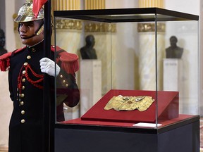 The gold mask of the Lord of Sican, from the Sican culture that inhabited the north coast of Peru between the eighth and 14th centuries, is displayed at the Government Palace in Lima on September 10, 2018 after it was handed over by Germany on September 6. (CRIS BOURONCLE/AFP/Getty Images)