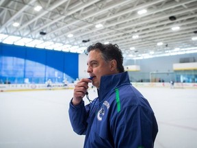 Vancouver Canucks head coach Travis Green watches players participate in a drill during NHL hockey training camp in Whistler, B.C., on Friday September 14, 2018.