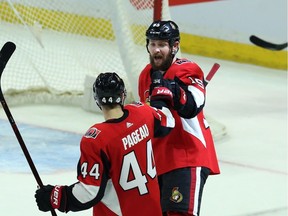 Ottawa Senators Zack Smith celebrates his goal against the New Jersey Devils with teammate Jean-Gabriel Pageau(44) during second period NHL action in Ottawa, Tuesday, Feb. 6, 2018.