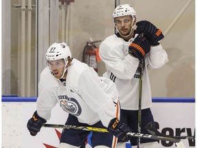 Edmonton Oilers Connor McDavid (97) and Ty Rattie (8) wait for their line to take part in a drill during the Edmonton Oilers training camp in Edmonton on Friday September 14, 2018.