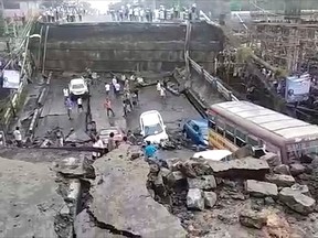 This grab made from video provided by Indranil Mukherjee, an eyewitness shows a highway overpass that collapsed in Kolkata, India, Tuesday, Sept. 4, 2018.