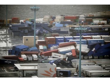 Containers fall near a port in Osaka, western Japan, following a powerful typhoon hit the region, in Tuesday, Sept. 4, 2018.
